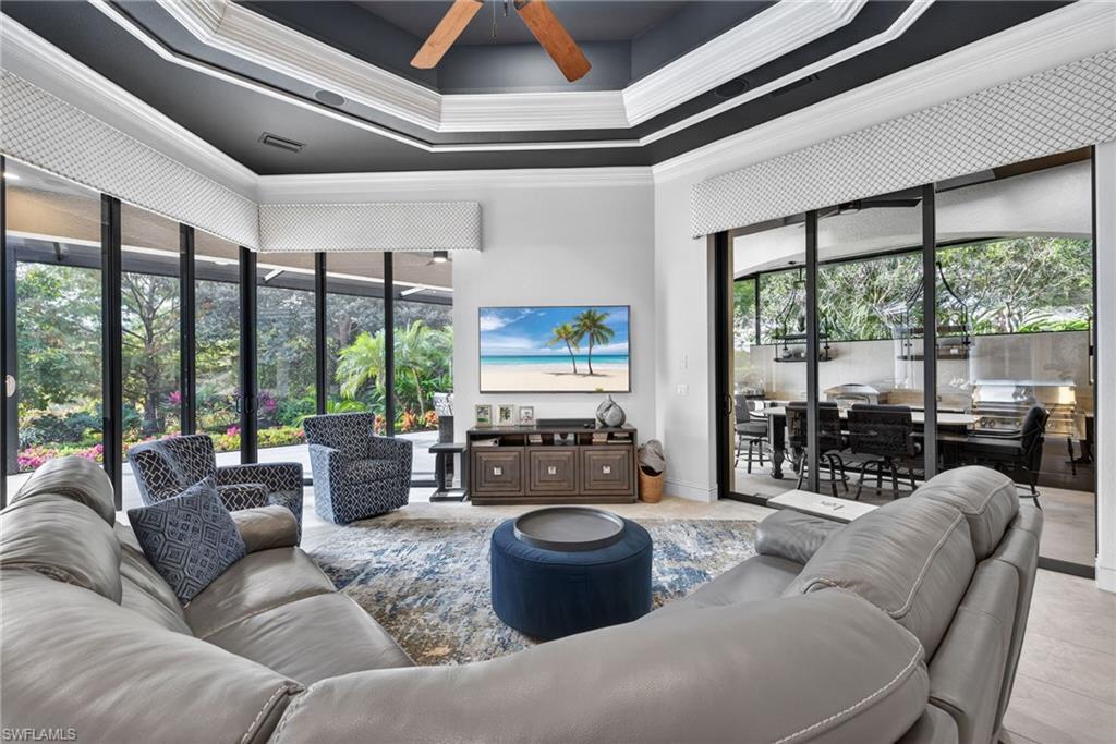 16488 Felicita Court Naples, FL 34110 - Photo 15 of 50 a living room with furniture and large windows