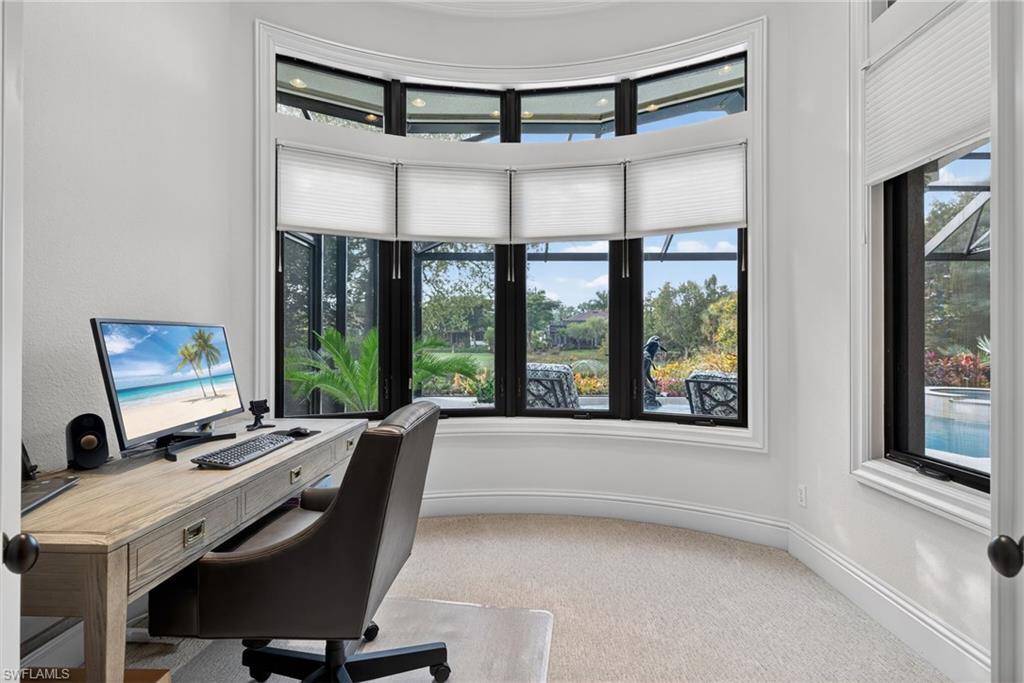 16488 Felicita Court Naples, FL 34110 - Photo 19 of 50 a view of a workspace with furniture and a window