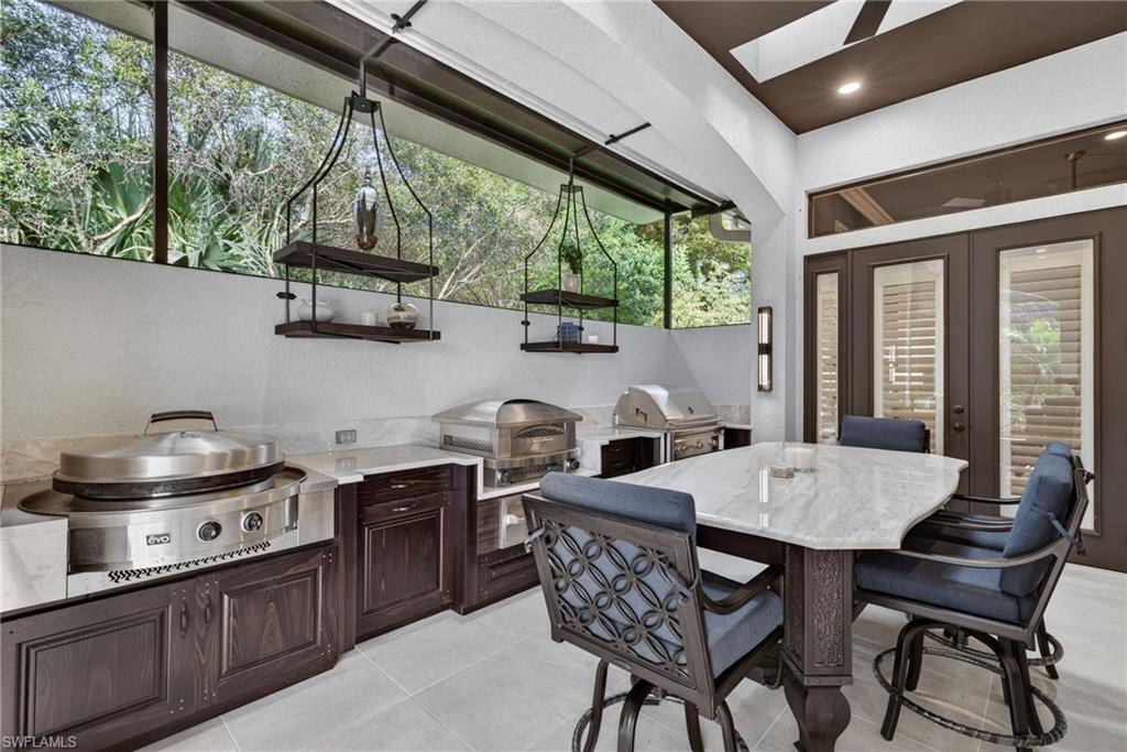 16488 Felicita Court Naples, FL 34110 - Photo 40 of 50 a view of a dining room with furniture window and outside view