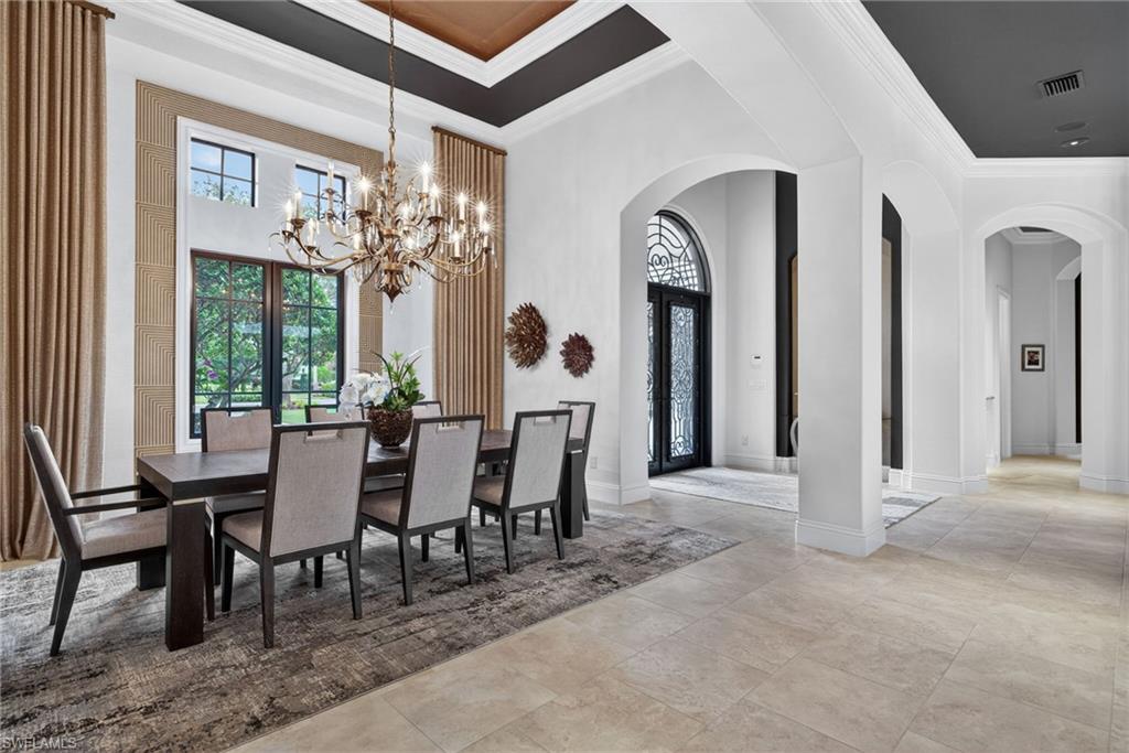16488 Felicita Court Naples, FL 34110 - Photo 4 of 50 a view of a dining room with furniture and a large window