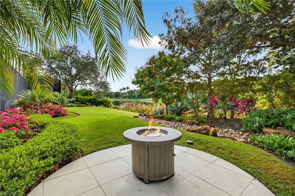 16488 Felicita Court Naples, FL 34110 - Photo 46 of 50 a view of a table and chairs in the garden