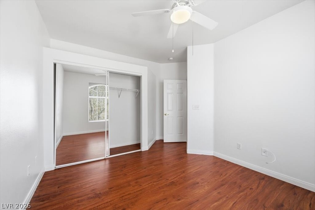 2050 West Warm Springs Road, Unit 3722 Henderson, NV 89014 - Photo 24 of 37 Second primary bedroom with ceiling fan and mirrored closet doors