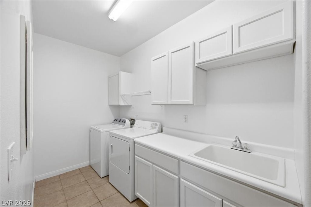 2050 West Warm Springs Road, Unit 3722 Henderson, NV 89014 - Photo 25 of 37 Spacious laundry room with storage cabinets and a utility sink.