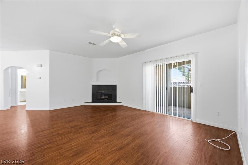 2050 West Warm Springs Road, Unit 3722 Henderson, NV 89014 - Photo 4 of 37 Expansive great room with luxury wood flooring and a cozy gas fireplace.