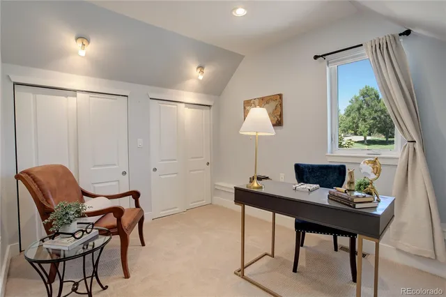 a workspace with furniture and a window