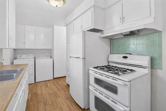 a kitchen with stainless steel appliances a refrigerator and a sink