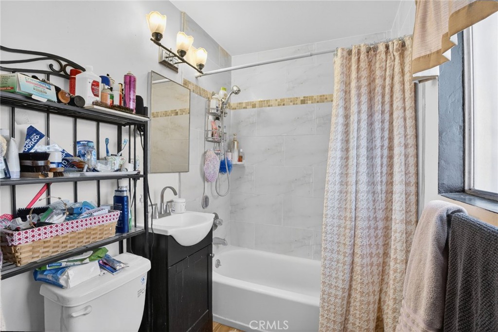 1650 Orange Street Riverside, CA 92501 - Photo 23 of 60 a bathroom with a sink toilet and shower