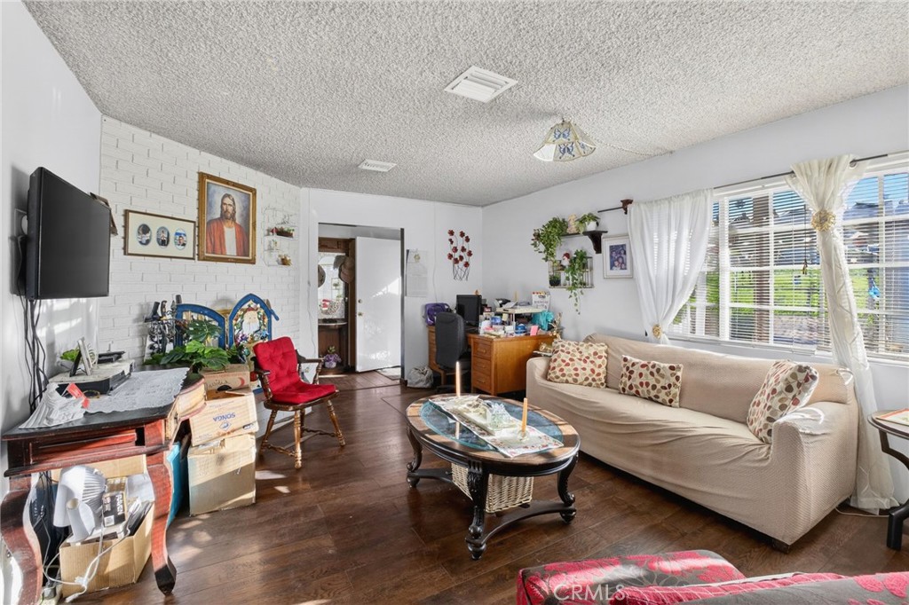 1650 Orange Street Riverside, CA 92501 - Photo 26 of 60 a living room with furniture and a flat screen tv