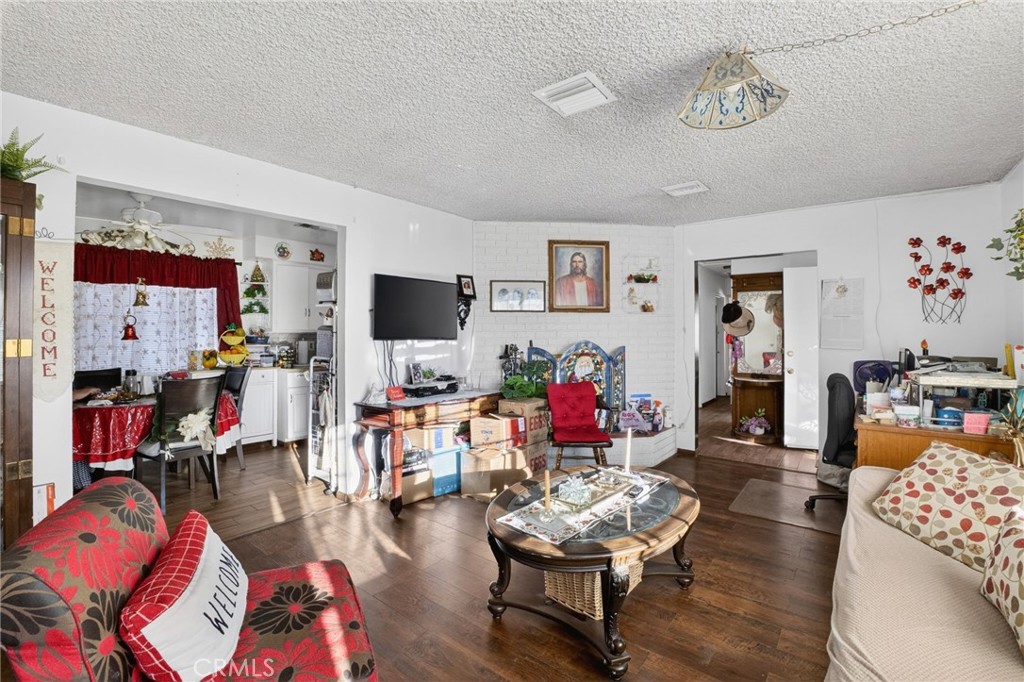 1650 Orange Street Riverside, CA 92501 - Photo 27 of 60 a living room with furniture and a flat screen tv