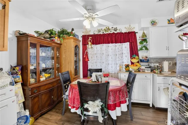 a view of a dining room with furniture and chandelier