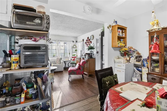 a kitchen with stainless steel appliances granite countertop a stove and a refrigerator