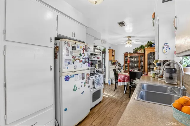 a kitchen filled with furniture and a kitchen view