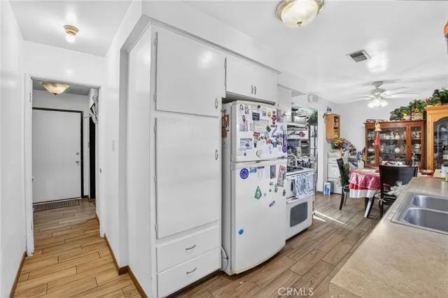 a bedroom with furniture and a flat screen tv