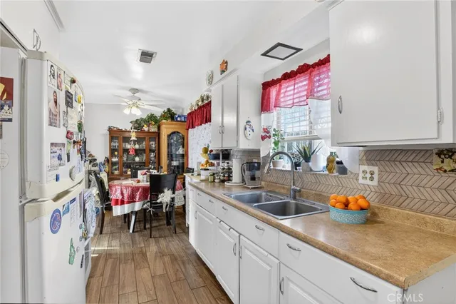 a bedroom with furniture and a chandelier