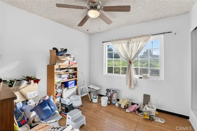 a bedroom with a bed and flat screen tv