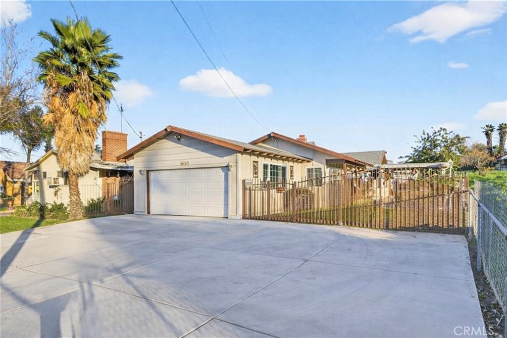 1650 Orange Street Riverside, CA 92501 - Photo 4 of 60 a view of a house with a yard and potted plants