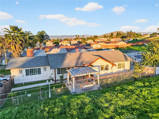 a view of a porch with furniture and garden