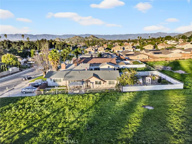 a front view of a house with a yard table and chairs