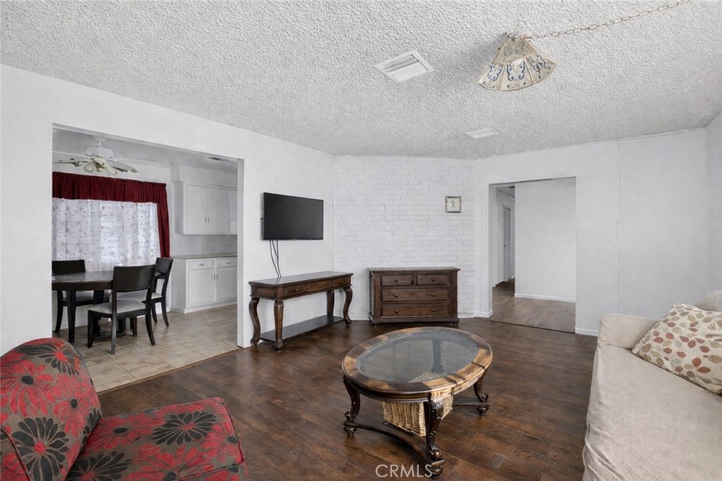 1650 Orange Street Riverside, CA 92501 - Photo 8 of 60 a living room with furniture and a flat screen tv