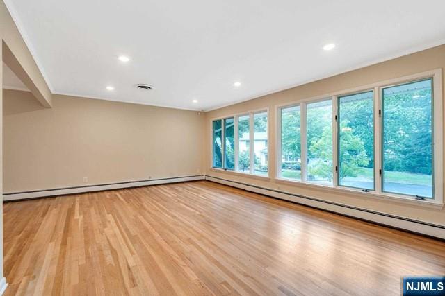 32 Rock Road Englewood Cliffs, NJ 07632 - Photo 14 of 30 a view of an empty room with wooden floor and a window