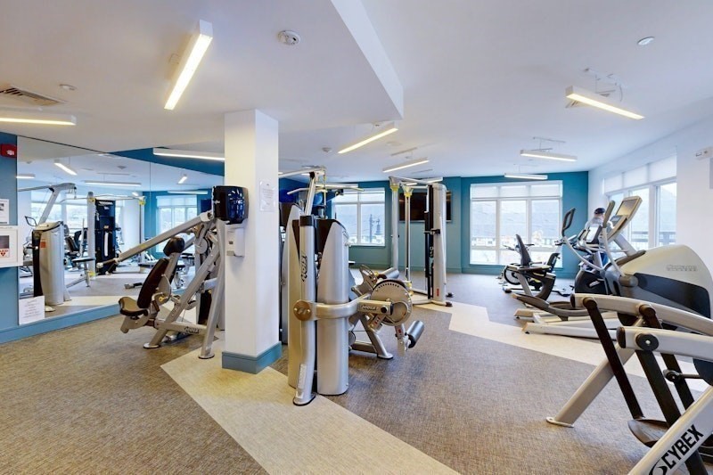 180 Telford Street, Unit 321 Boston, MA 02135 - Photo 2 of 10 a view of a room with gym equipment