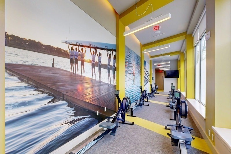 180 Telford Street, Unit 321 Boston, MA 02135 - Photo 3 of 10 a view of gym equipment with wooden floor