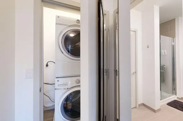 a view of a hallway with washer and dryer
