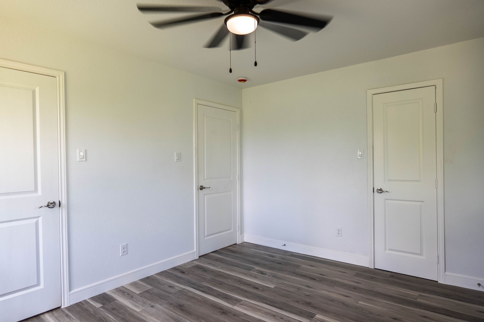 8718 Magna Street Houston, TX 77093 - Photo 17 of 33 a view of an empty room with wooden floor