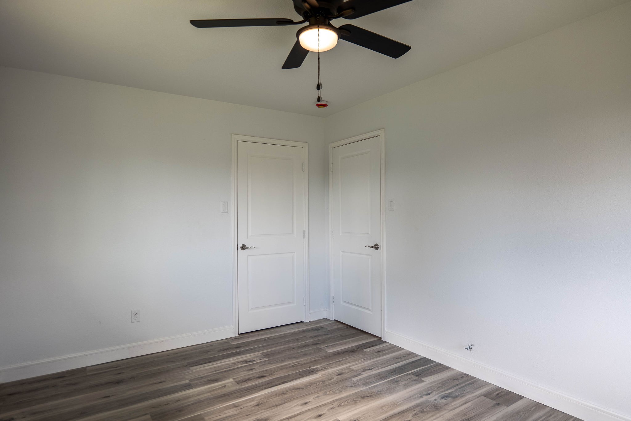 8718 Magna Street Houston, TX 77093 - Photo 20 of 33 a view of an empty room and wooden floor