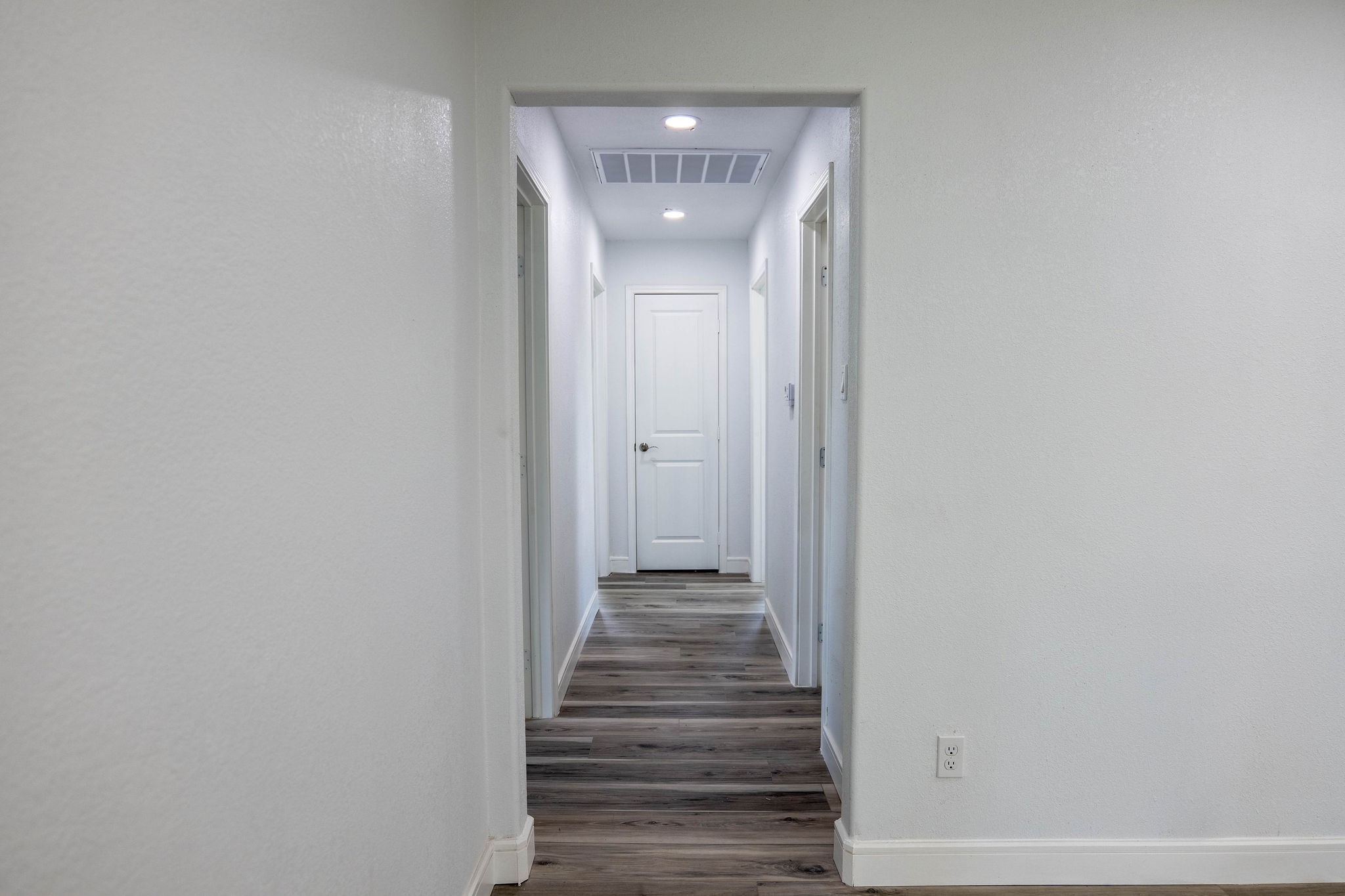 8718 Magna Street Houston, TX 77093 - Photo 23 of 33 a view of a hallway with wooden staircase