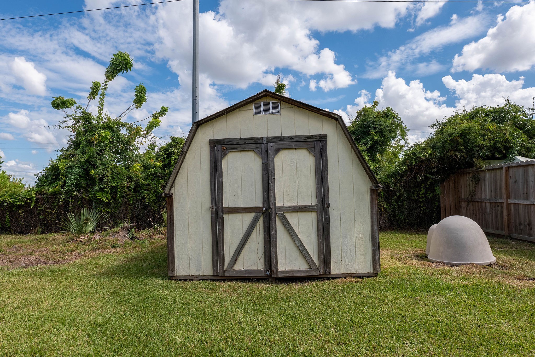 8718 Magna Street Houston, TX 77093 - Photo 26 of 33 a front view of a house with garden