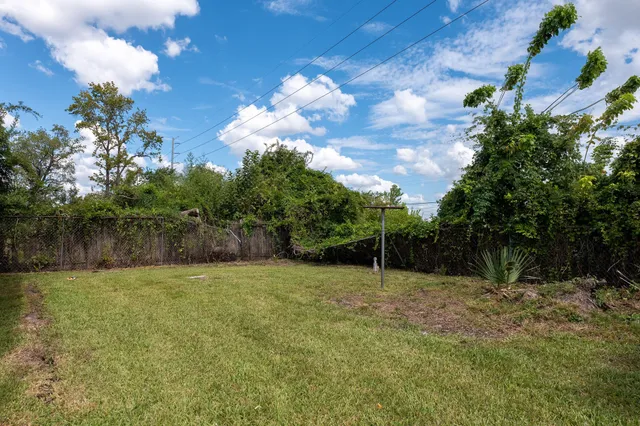 a backyard of a house with lots of green space