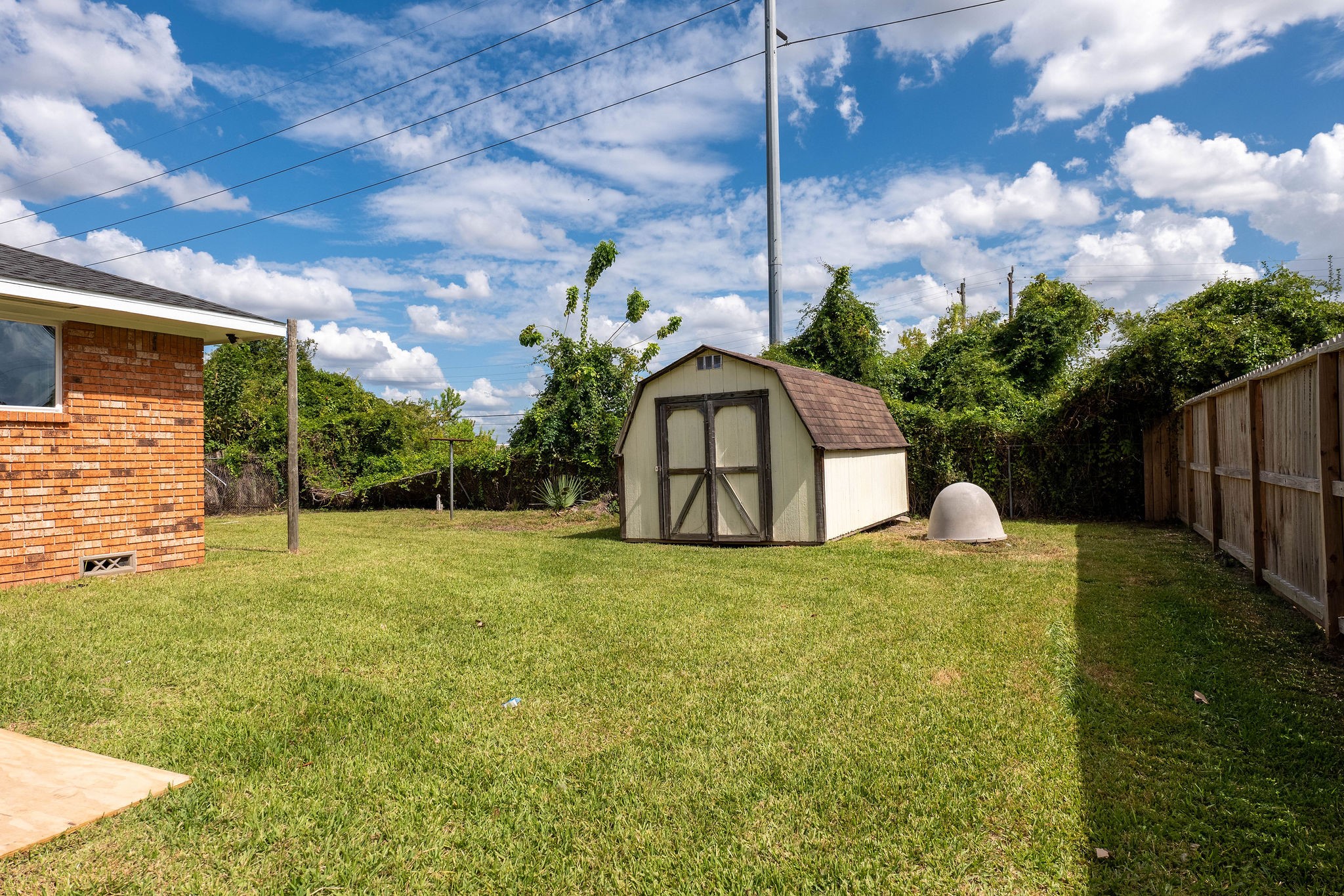 8718 Magna Street Houston, TX 77093 - Photo 30 of 33 a house view with swimming pool and garden
