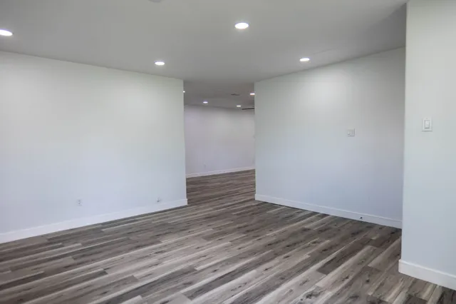 a view of room with wooden floor