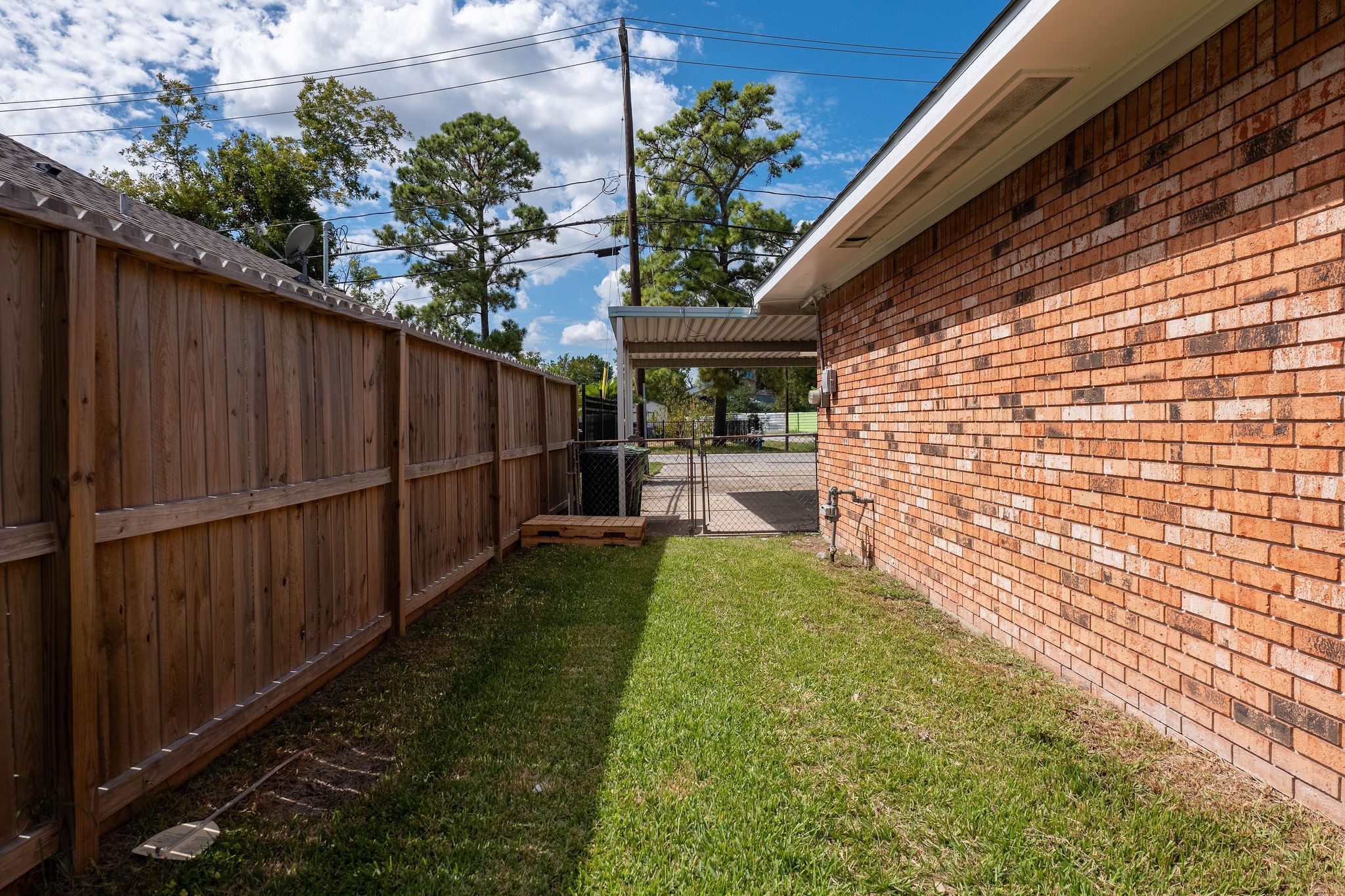 8718 Magna Street Houston, TX 77093 - Photo 31 of 33 a backyard of a house with lots of green space