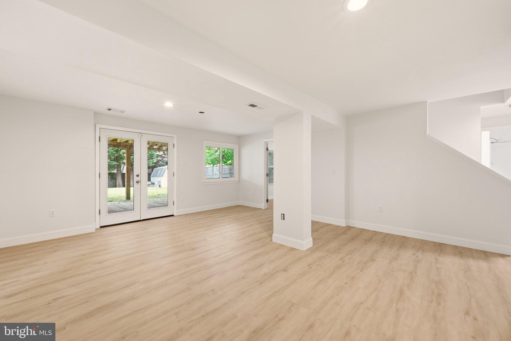 11117 Midvale Road Kensington, MD 20895 - Photo 20 of 25 Lower Level Rec Room with walk out to back yard