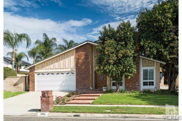2664 Wheatfield Circle Simi Valley, CA 93063 - Photo 1 of 27 a view of a white house with a yard and plants