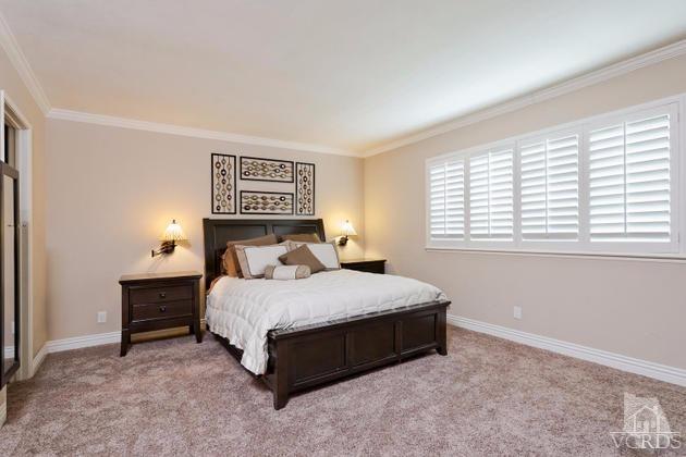 2664 Wheatfield Circle Simi Valley, CA 93063 - Photo 17 of 27 a bedroom with a bed lamp and a window