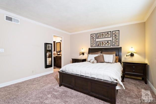 2664 Wheatfield Circle Simi Valley, CA 93063 - Photo 18 of 27 a large bed sitting in a bedroom and table