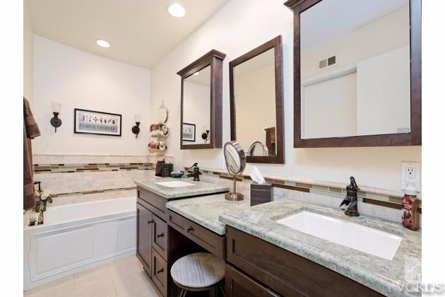 2664 Wheatfield Circle Simi Valley, CA 93063 - Photo 19 of 27 a bathroom with a granite countertop sink and a mirror