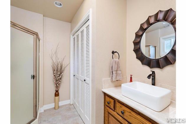 2664 Wheatfield Circle Simi Valley, CA 93063 - Photo 22 of 27 a bathroom with a sink and a mirror