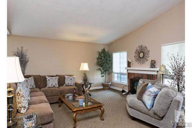 2664 Wheatfield Circle Simi Valley, CA 93063 - Photo 9 of 27 a living room with furniture a fireplace and a potted plant