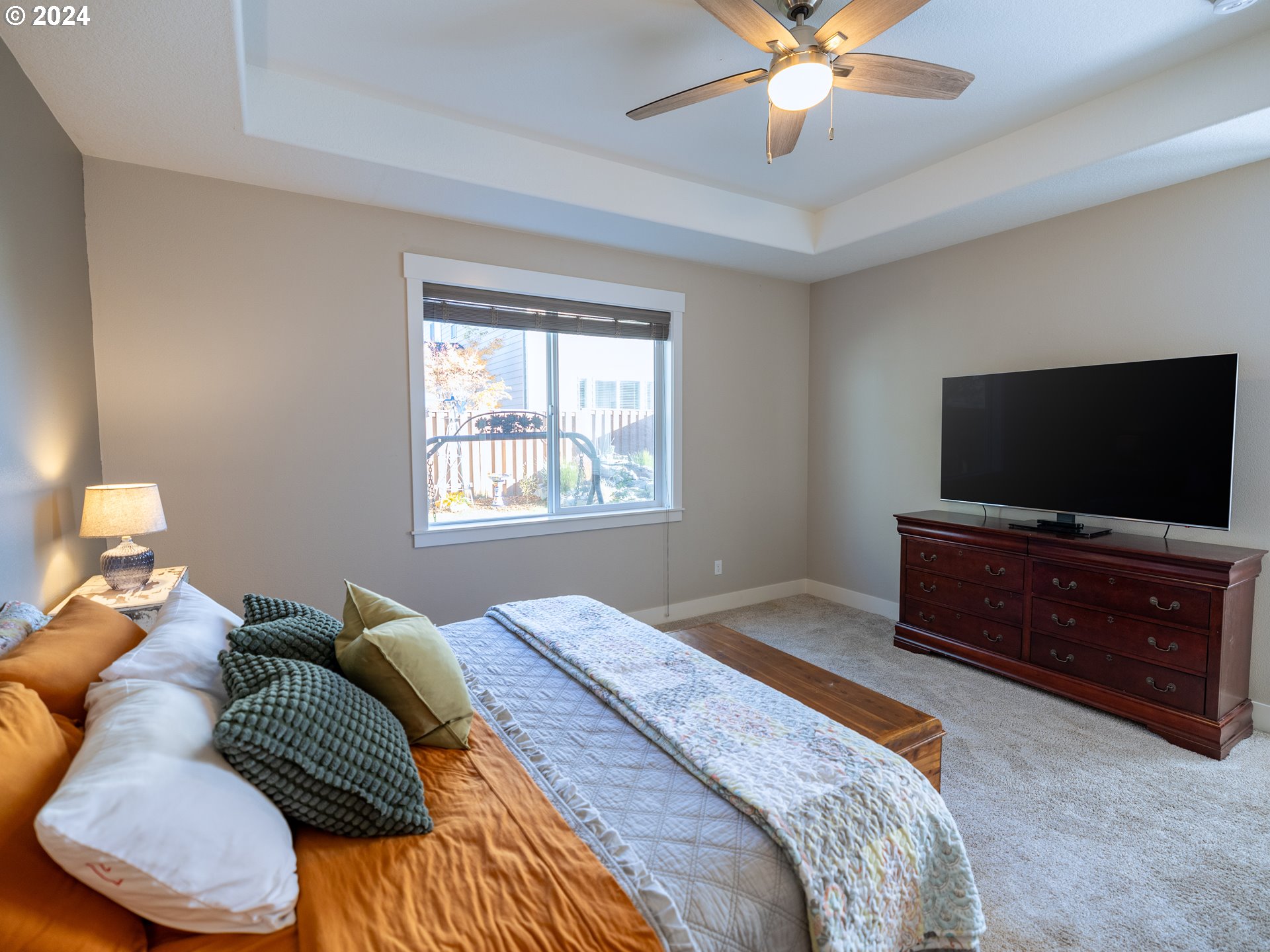 19390 Pine Avenue Sandy, OR 97055 - Photo 11 of 37 a bedroom with a bed and a flat screen tv