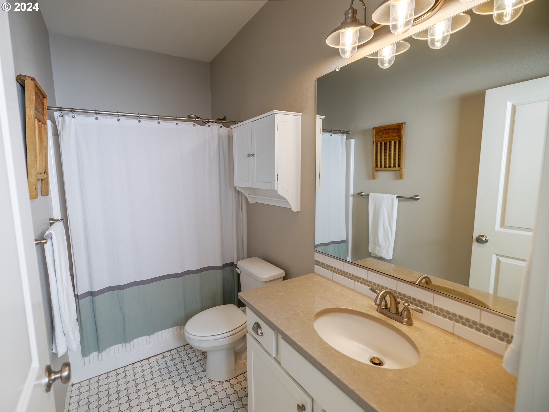 19390 Pine Avenue Sandy, OR 97055 - Photo 19 of 37 a bathroom with a granite countertop sink toilet and shower