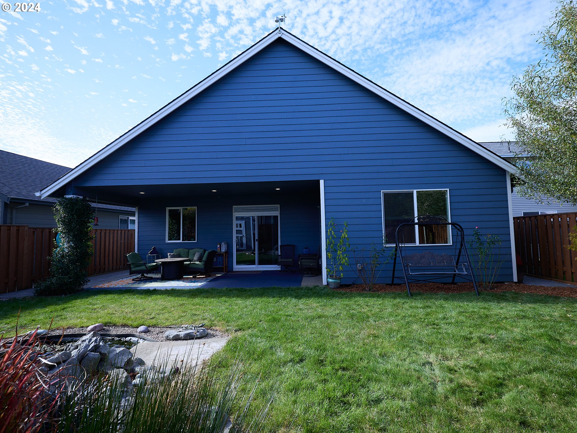 19390 Pine Avenue Sandy, OR 97055 - Photo 24 of 37 a view of a house with a yard and sitting area