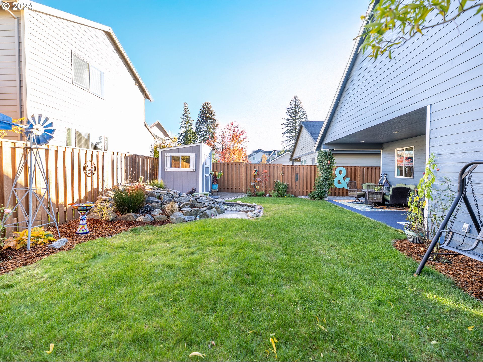 19390 Pine Avenue Sandy, OR 97055 - Photo 30 of 37 a view of a house with backyard and a patio