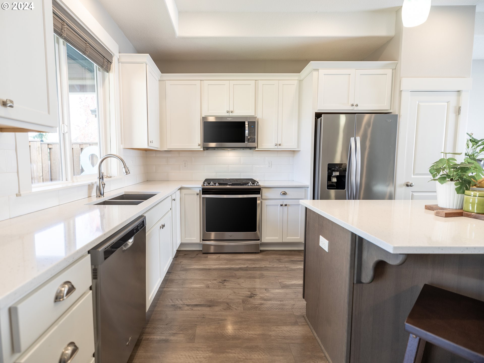 19390 Pine Avenue Sandy, OR 97055 - Photo 5 of 37 a kitchen with granite countertop a refrigerator a sink a stove a microwave and island