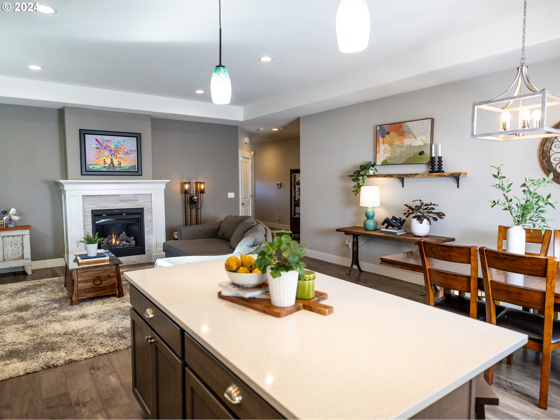 19390 Pine Avenue Sandy, OR 97055 - Photo 7 of 37 a kitchen with a stove a kitchen island a dining table and chairs