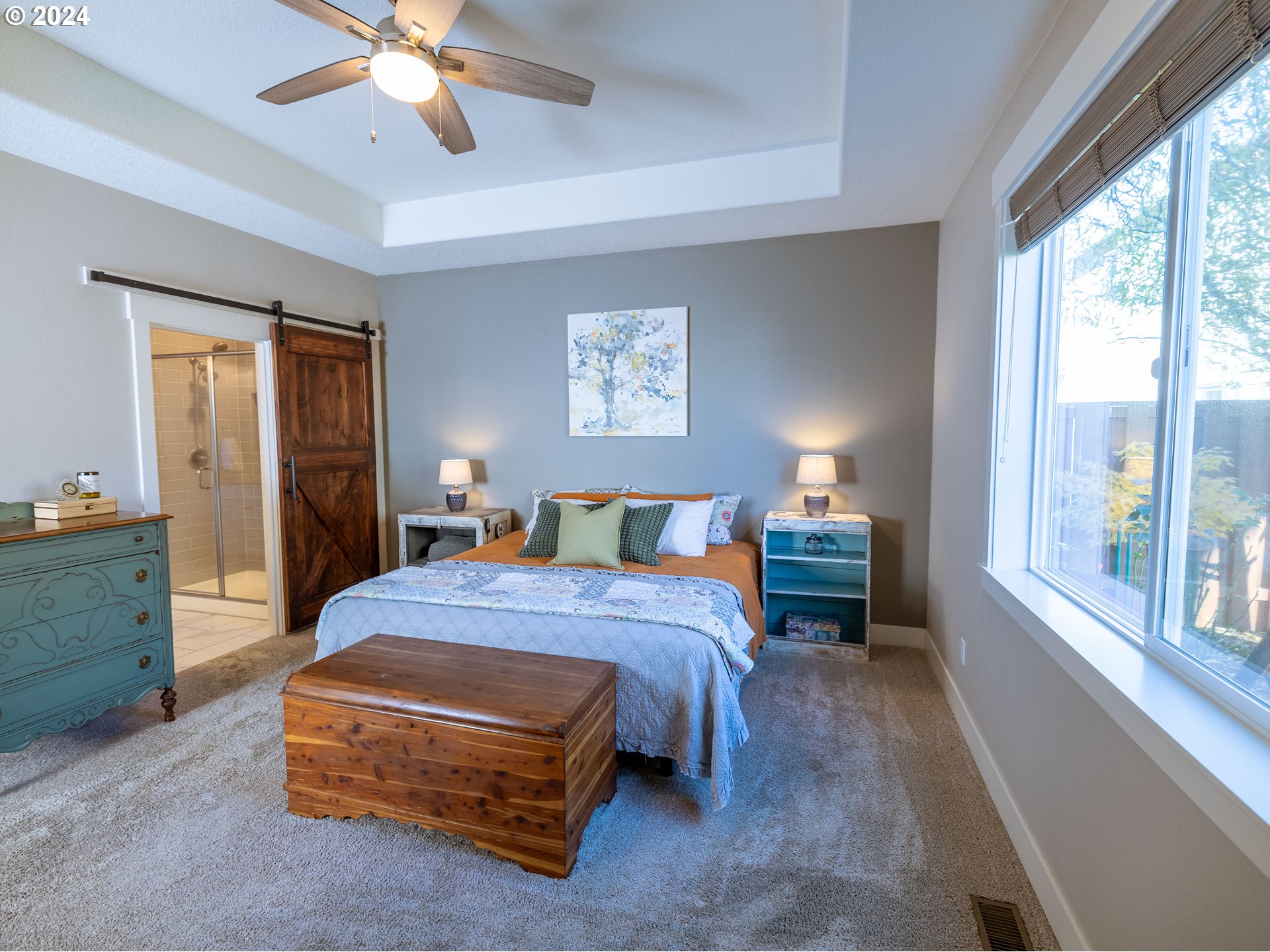 19390 Pine Avenue Sandy, OR 97055 - Photo 10 of 37 a bedroom with a bed and a chandelier