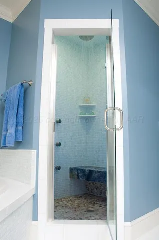 a bedroom with a bed and a night stand